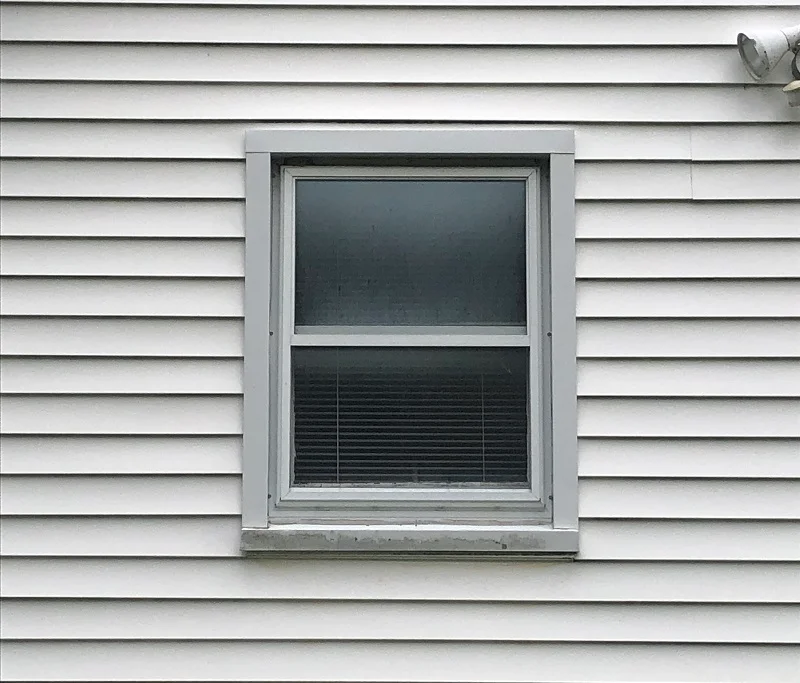 Storm Windows Are Removed During A Replacement Window Installation